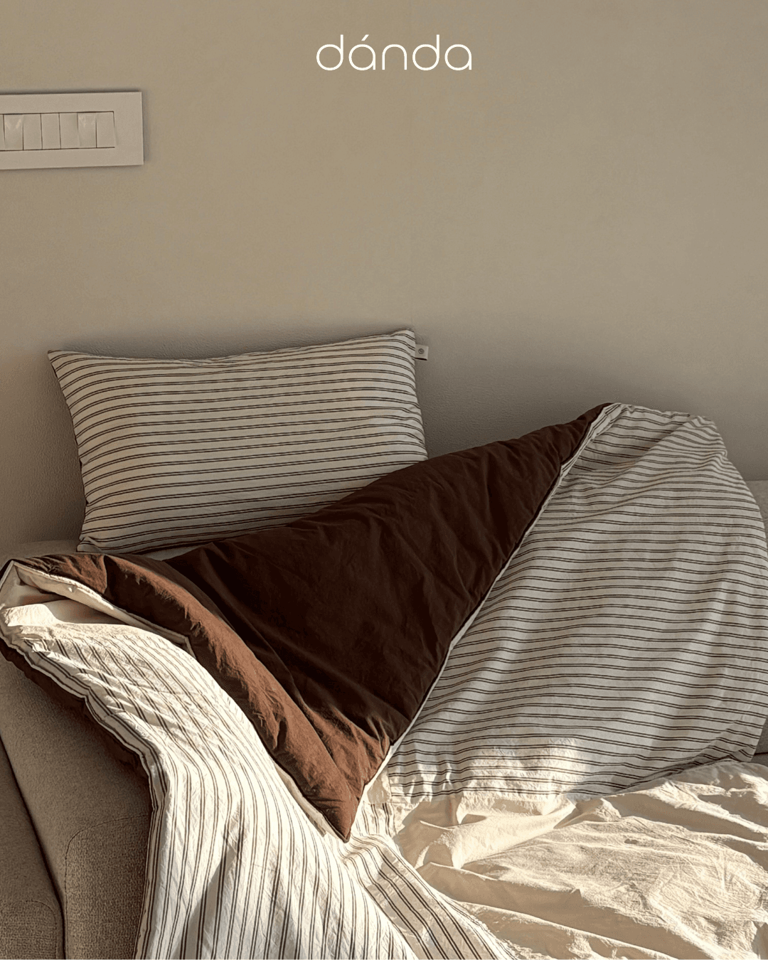 Cozy bedding set under warm morning light.
